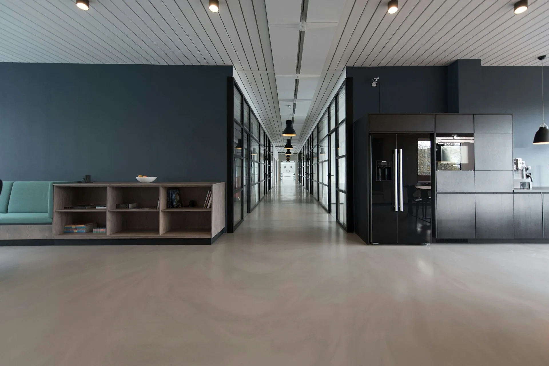 Converted interior with a glass-walled corridor (representative image)